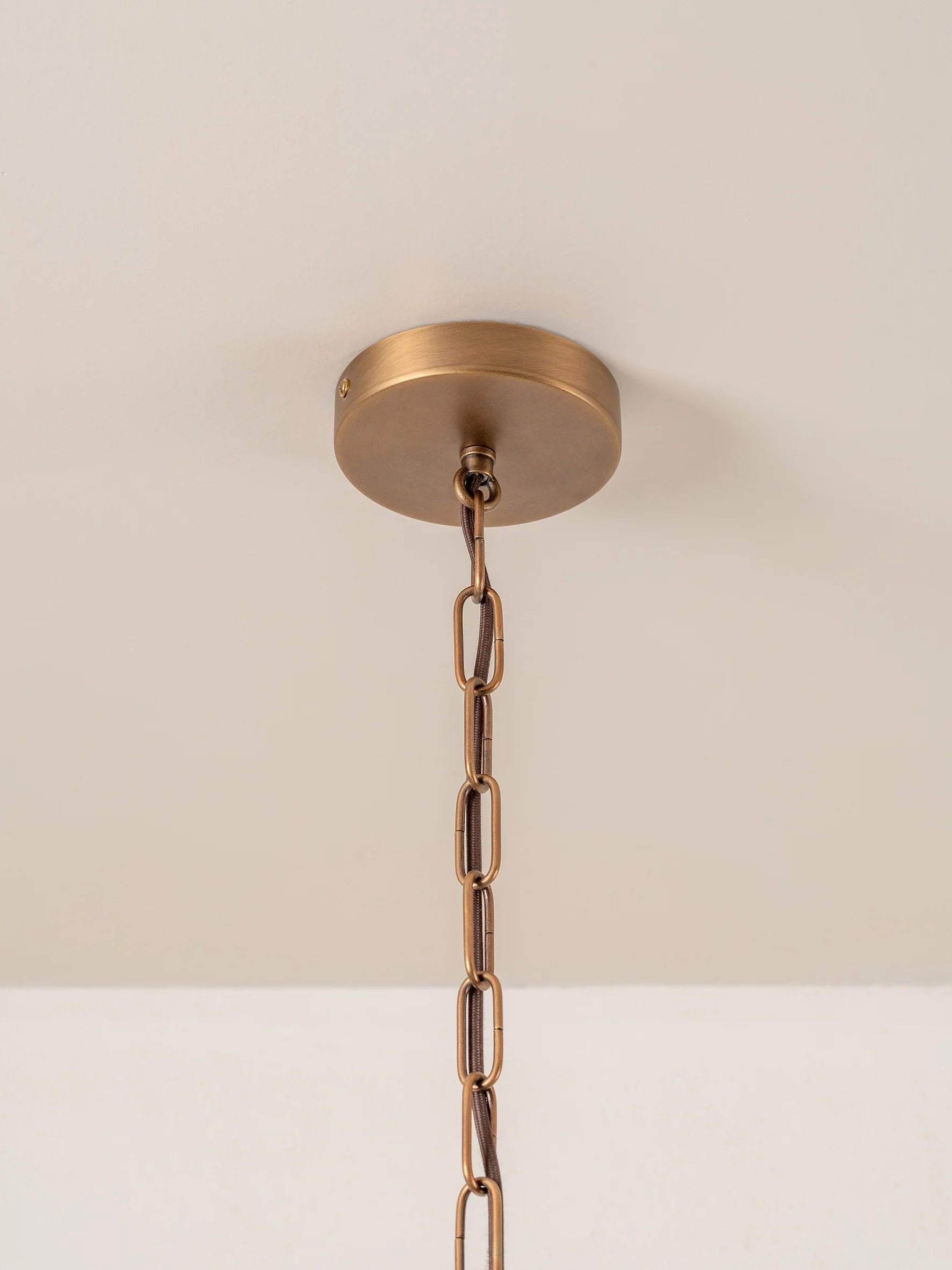 Cannoli - 10 light aged brass and textured glass chandelier