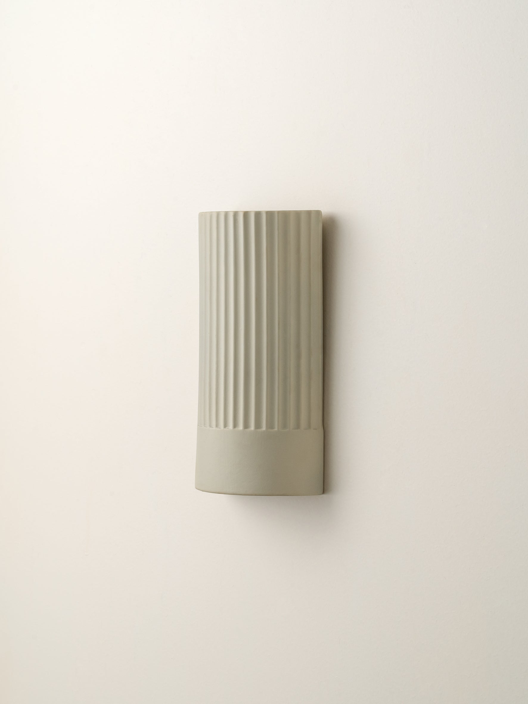 Enza - warm white  ribbed ceramic wall light