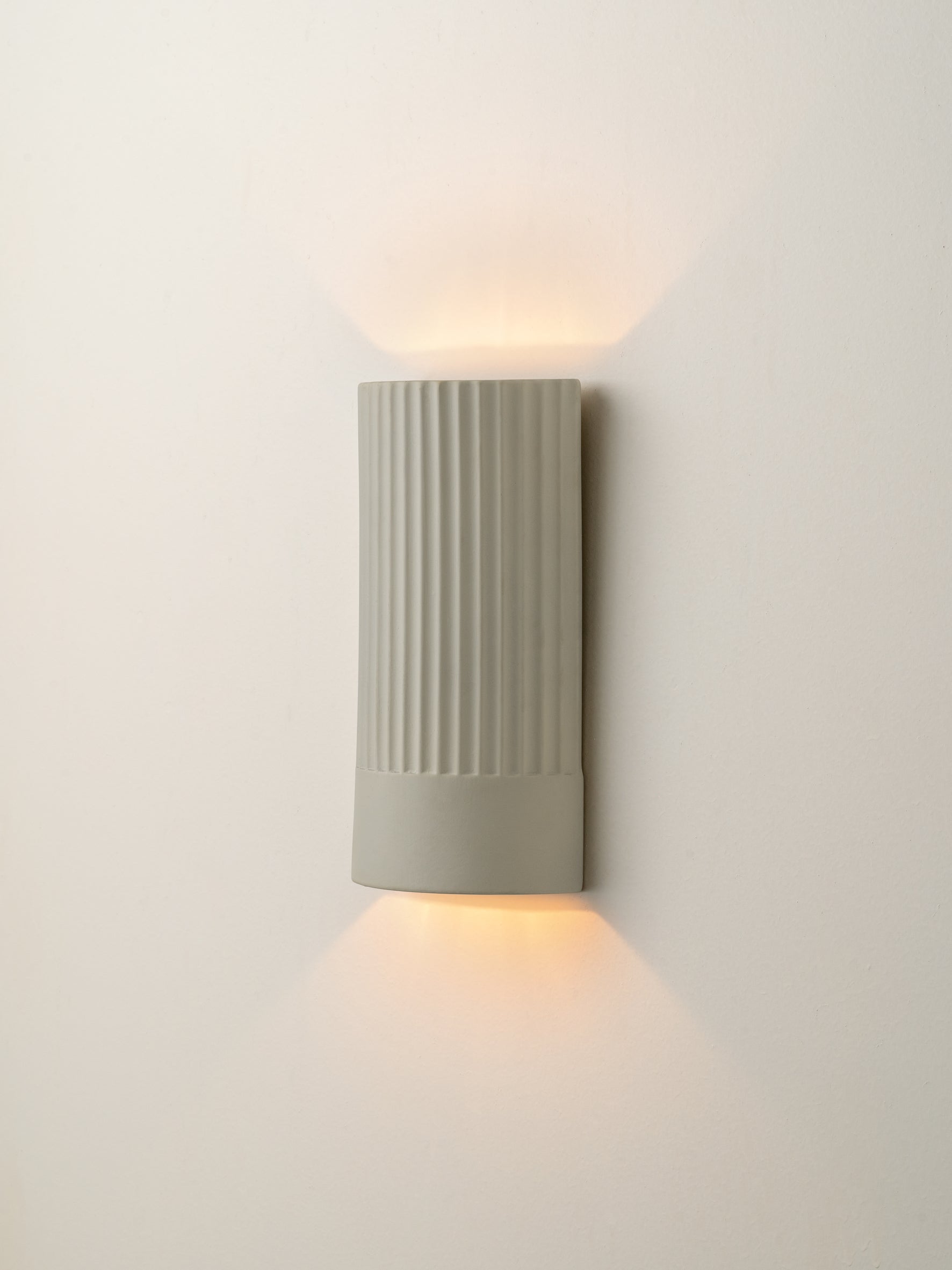 Enza - warm white  ribbed ceramic wall light