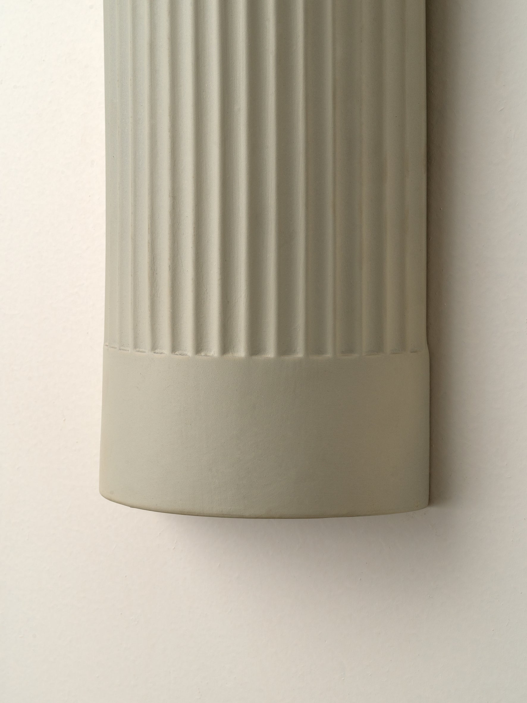 Enza - warm white  ribbed ceramic wall light