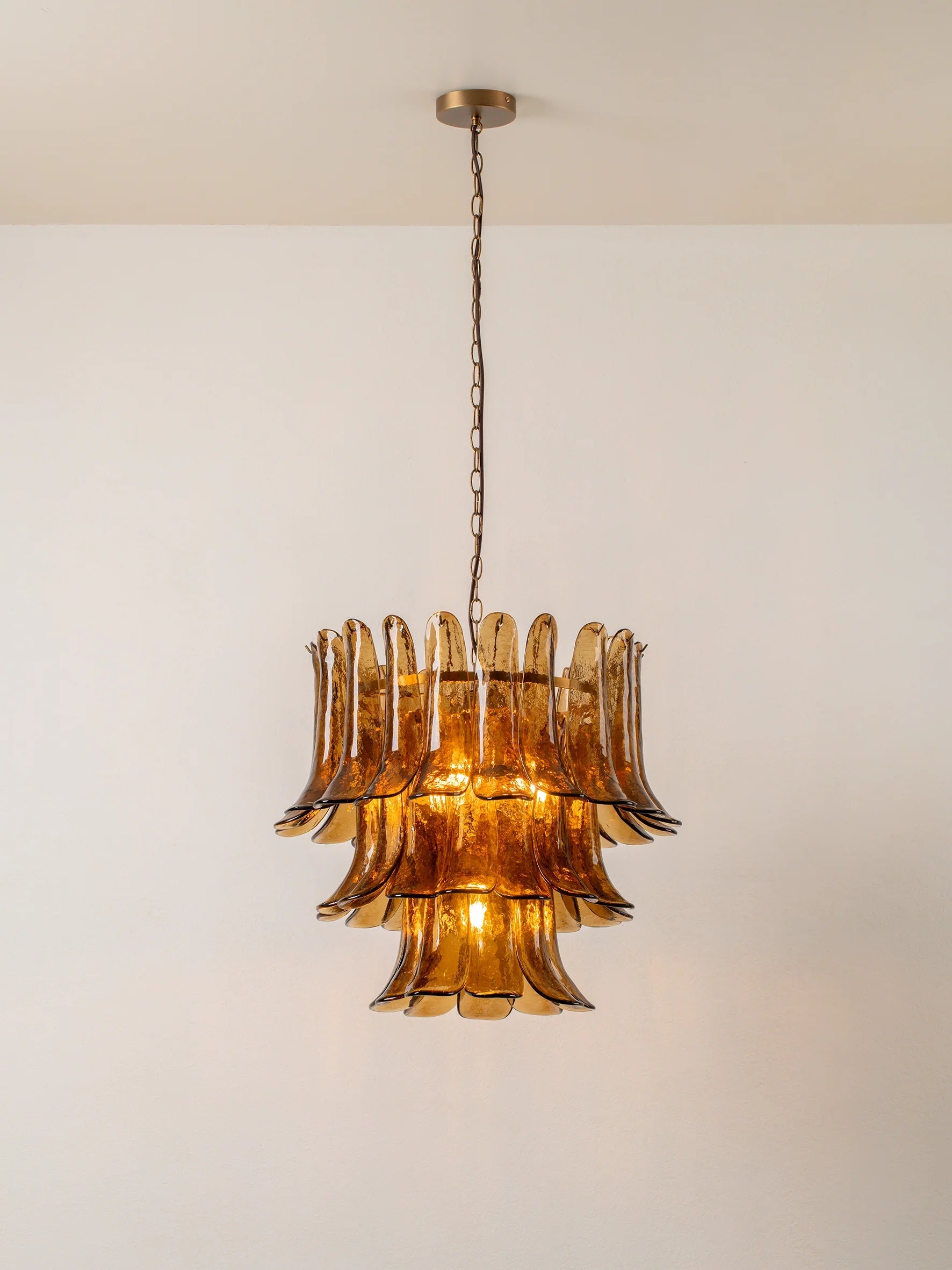 Lonso - 4 light aged brass and smoked brown glass chandelier