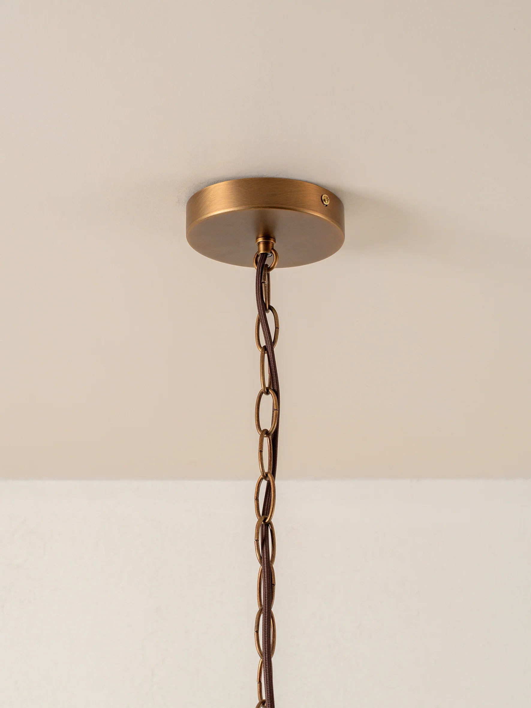 Lonso - 4 light aged brass and smoked brown glass chandelier