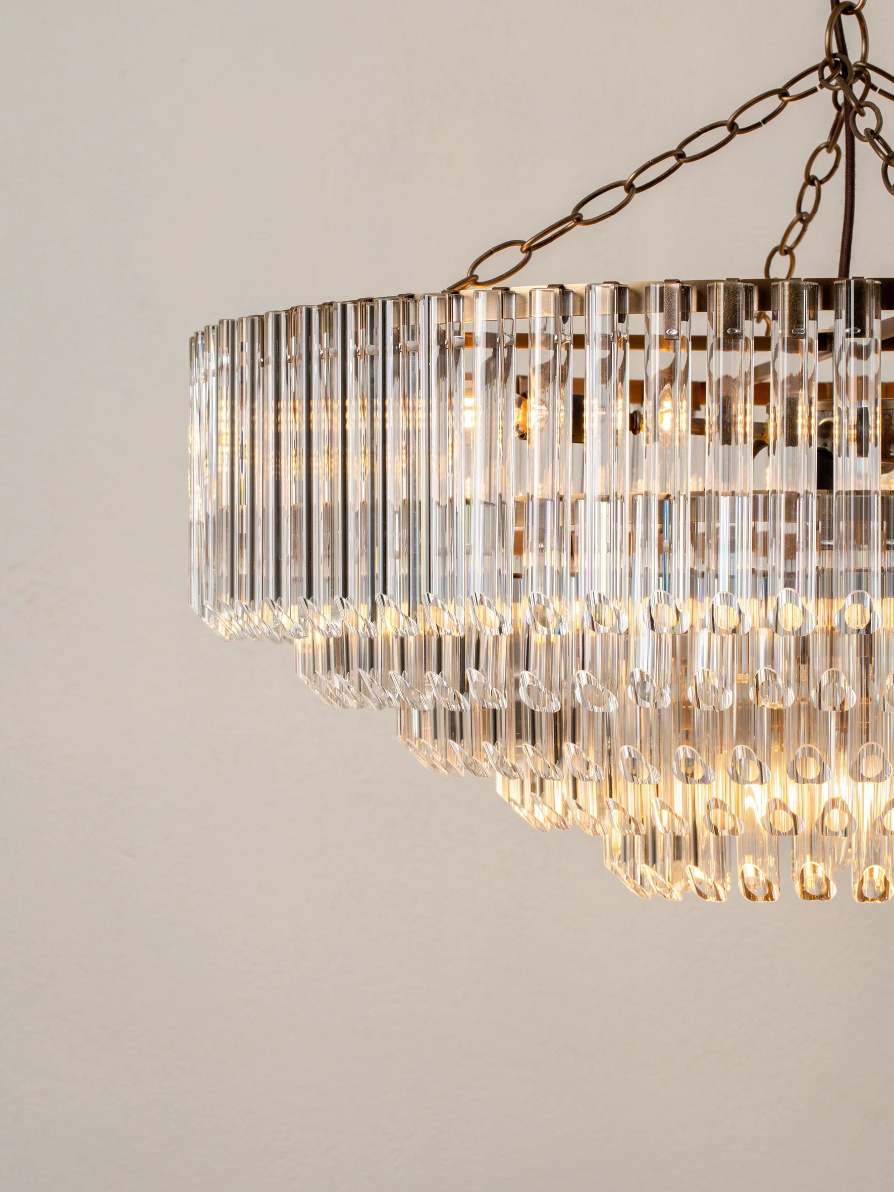 Petalia - 9 light aged brass and clear glass tube wide chandelier