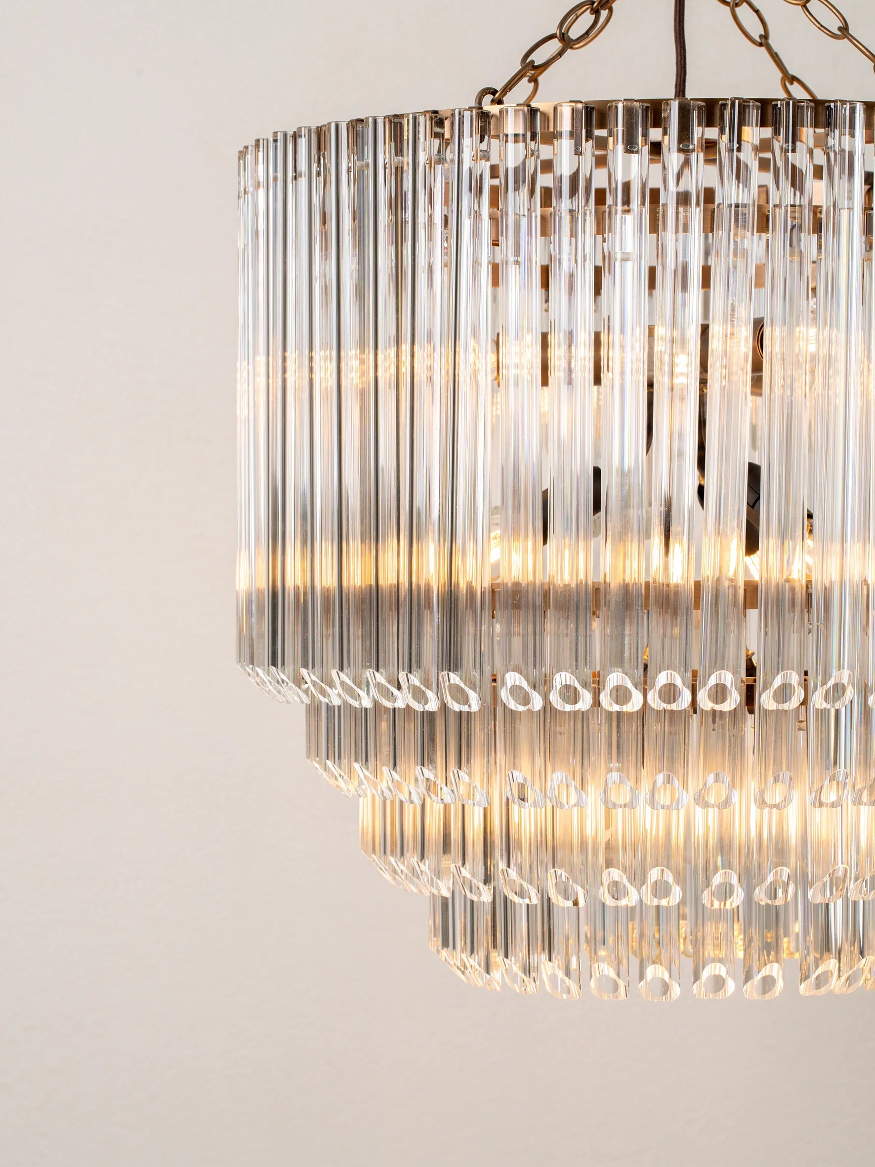 Petalia - 9 light aged brass and clear glass tube tall chandelier