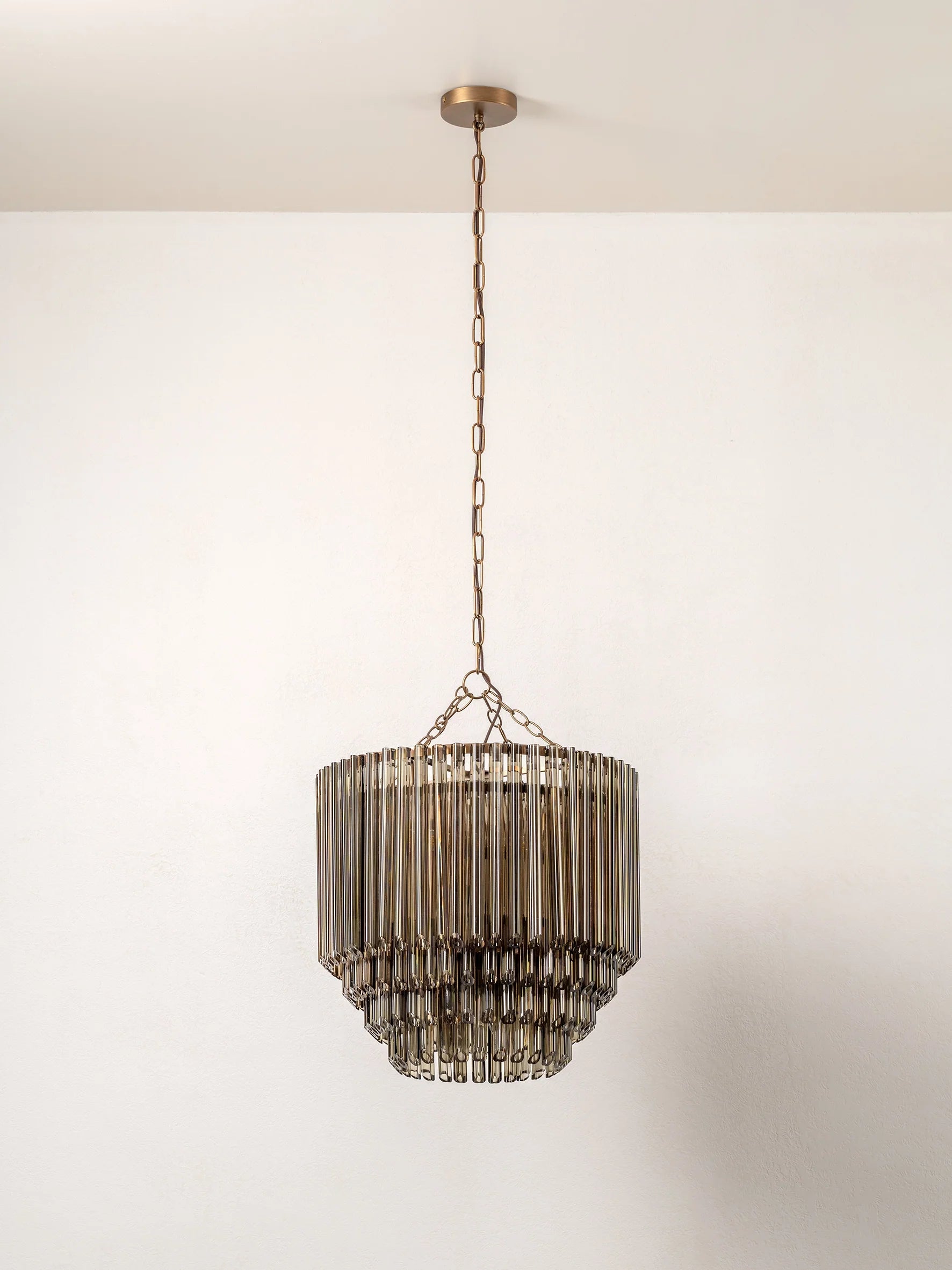 Petalia - 9 light aged brass and smoked green glass tube tall chandelier