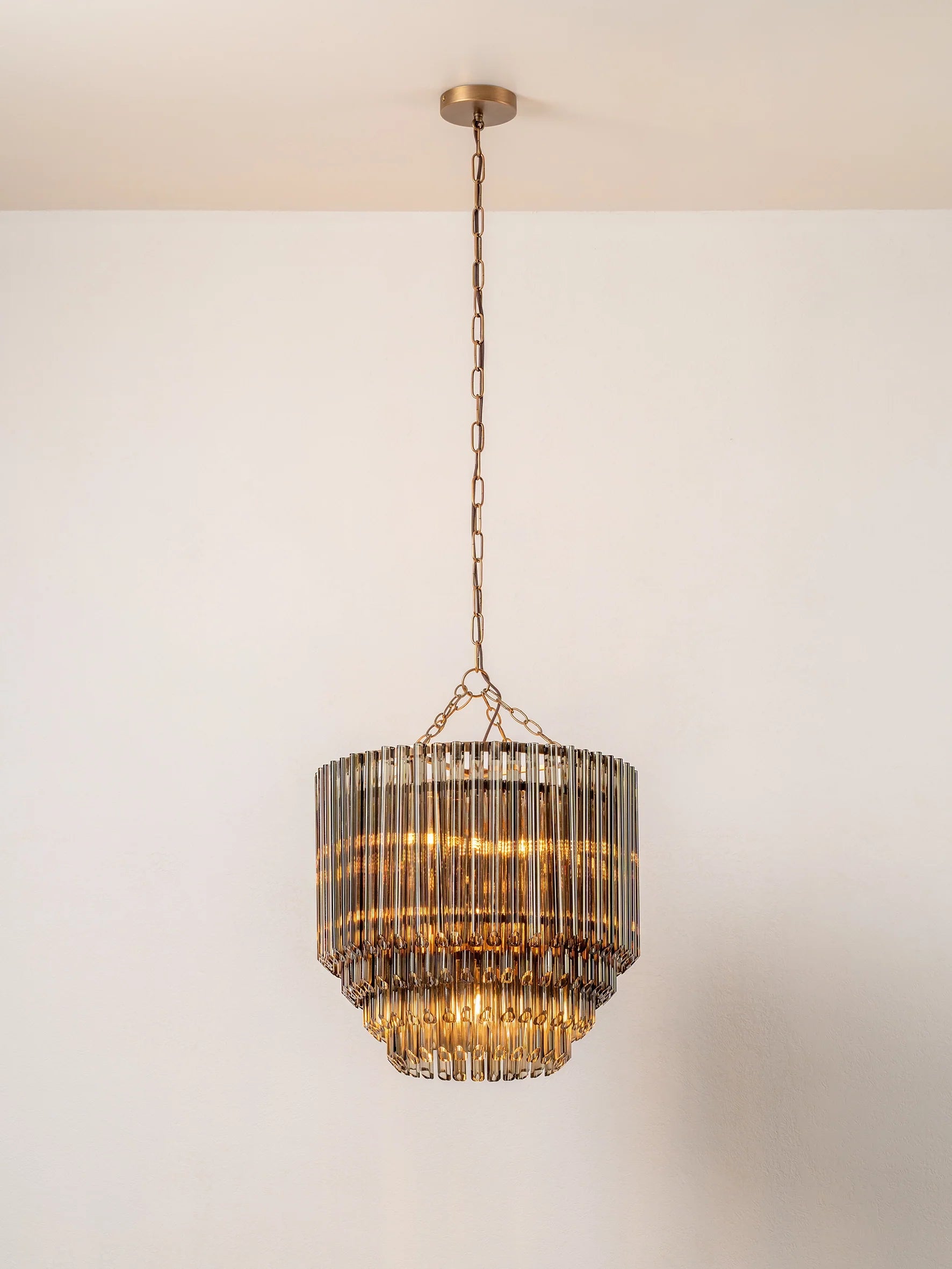 Petalia - 9 light aged brass and smoked green glass tube tall chandelier