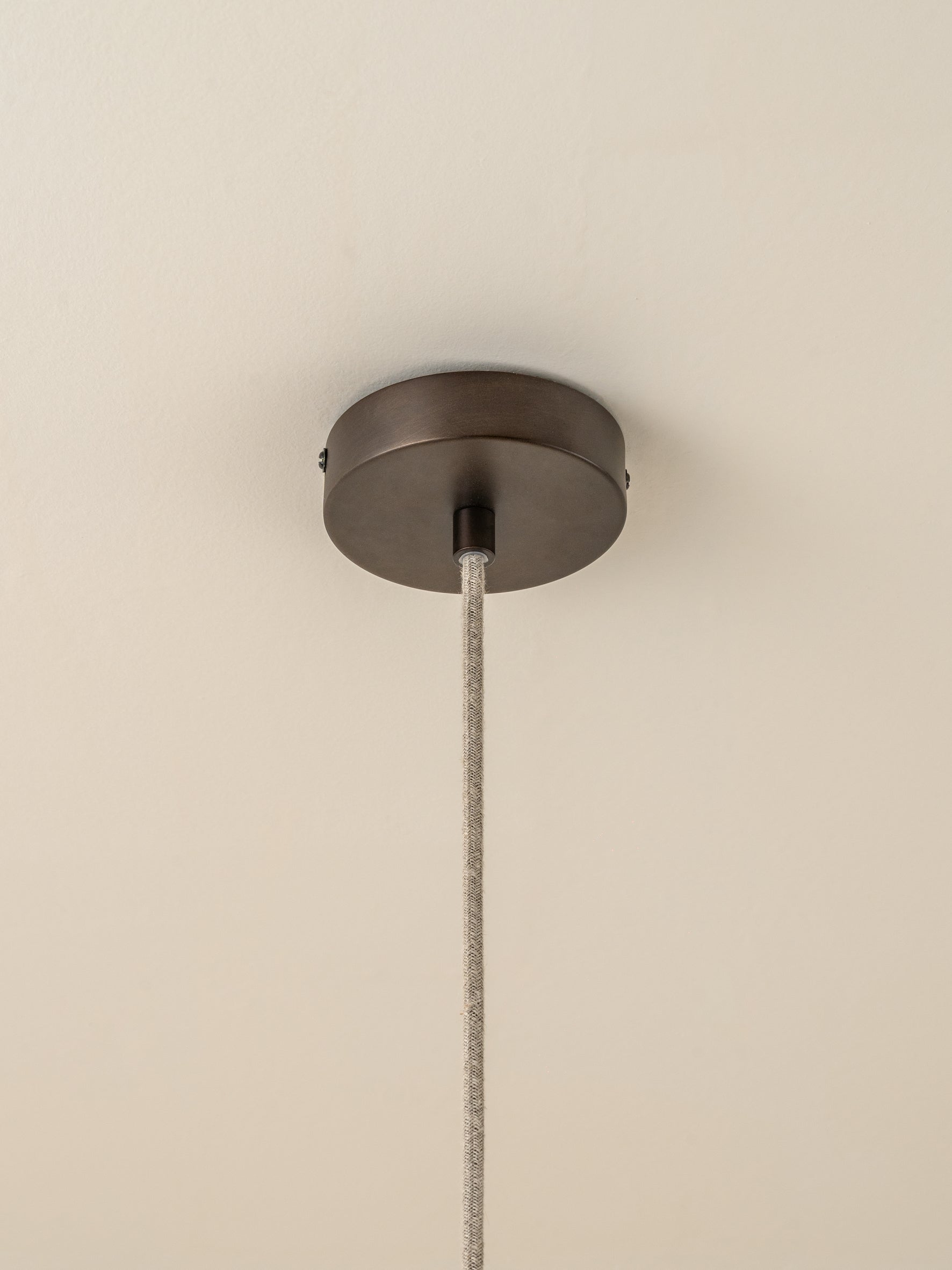 Solara - large dark bronze and layered natural linen pendant