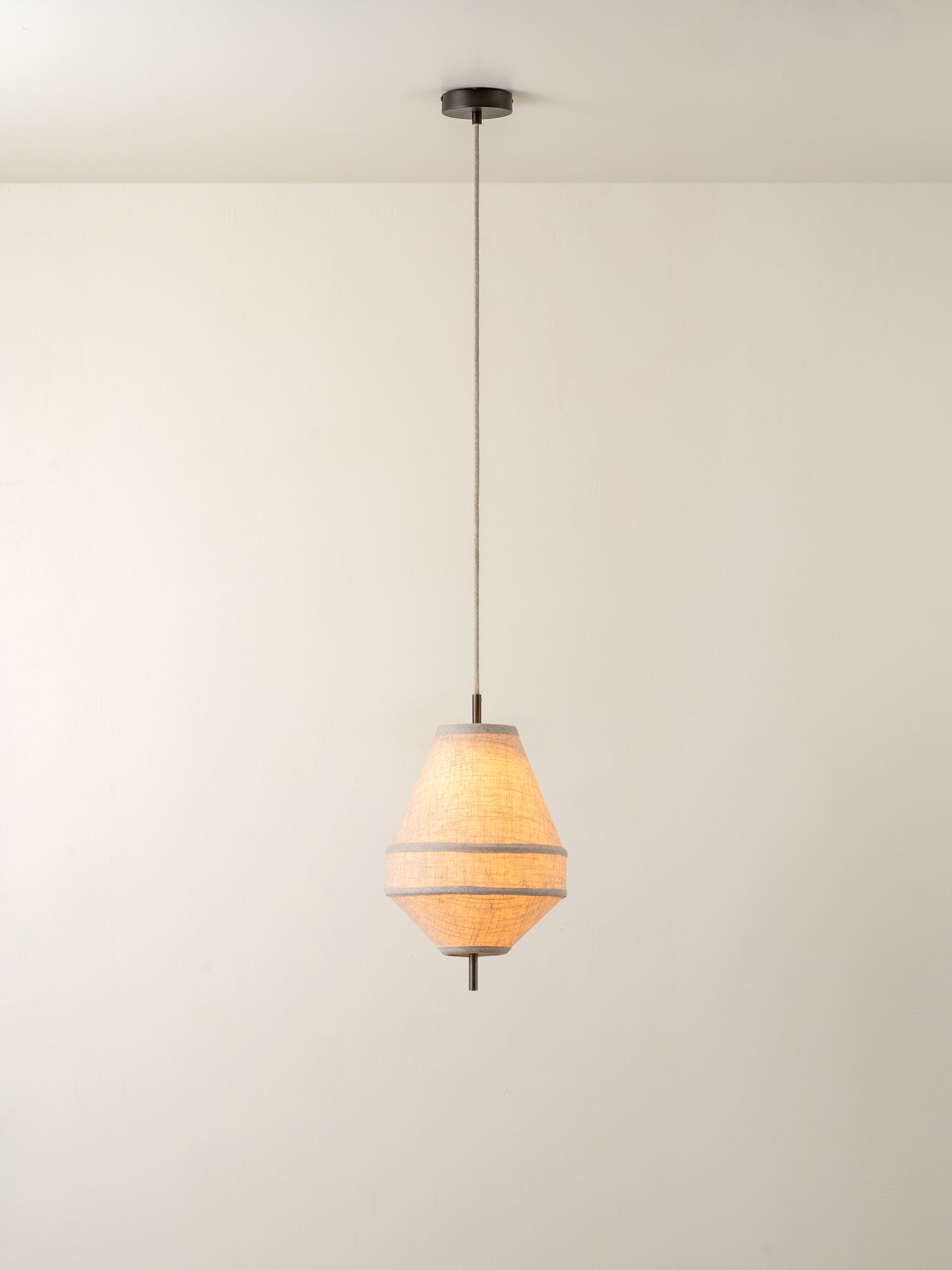 Solara - small dark bronze and layered natural linen pendant