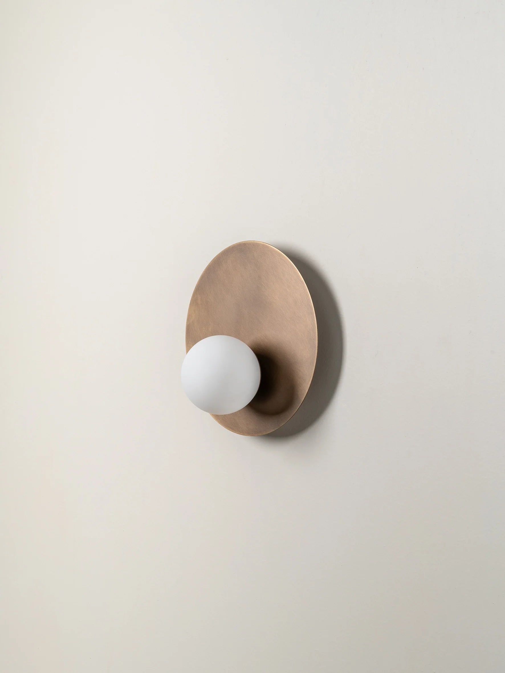 Luna - aged brass and opal disc wall light