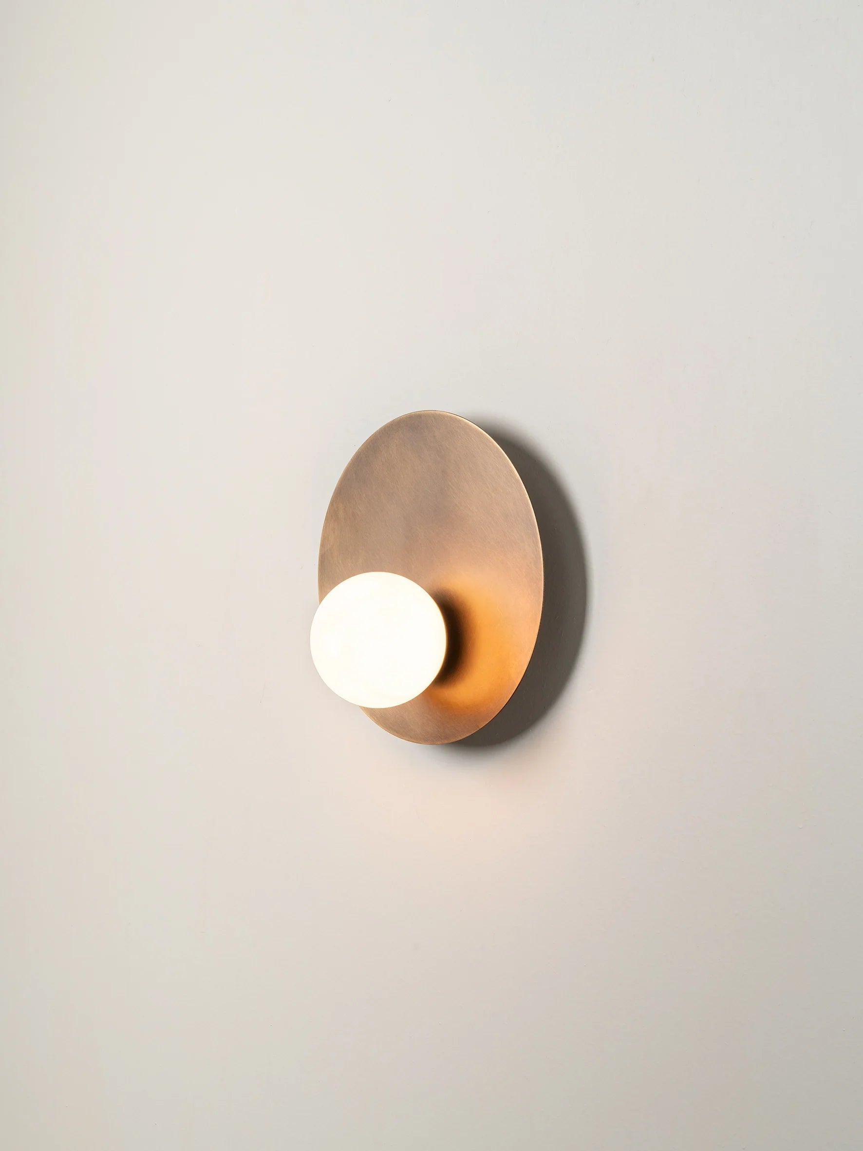 Luna - aged brass and opal disc wall light