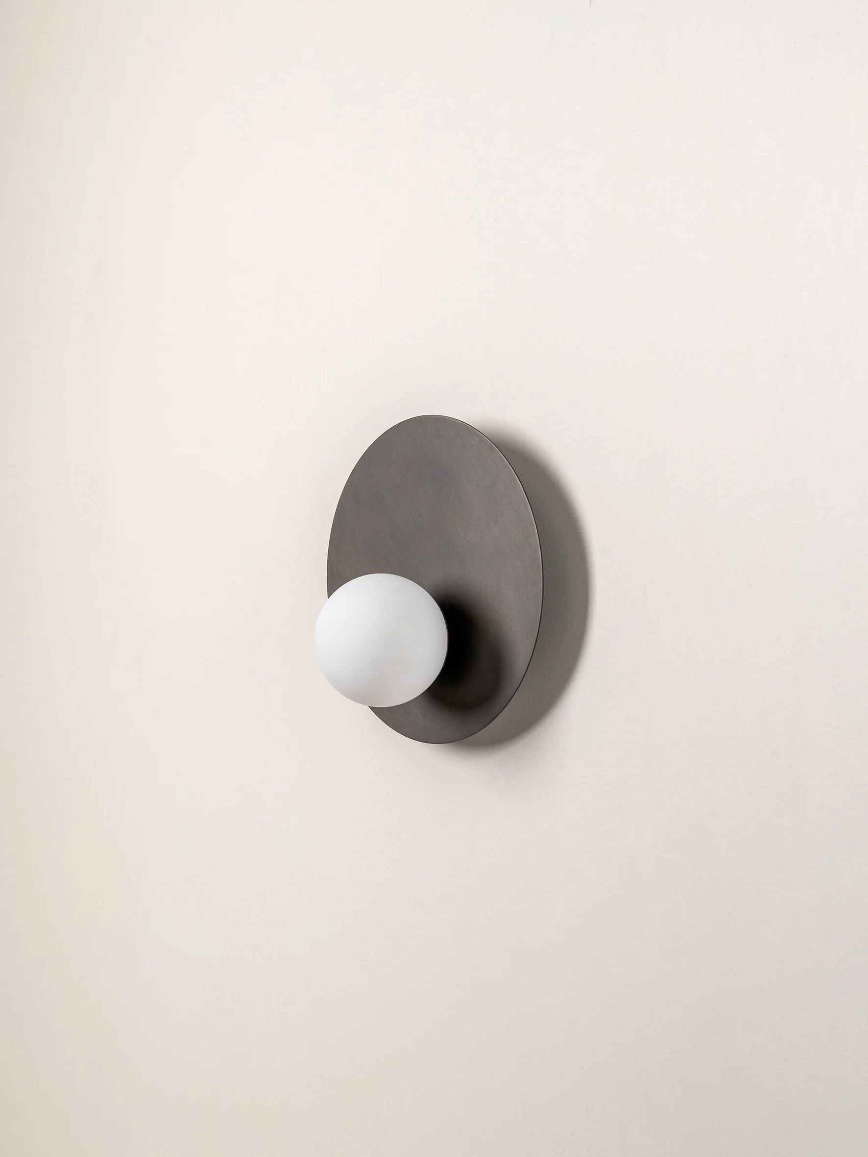 Luna - bronze and opal disc wall light