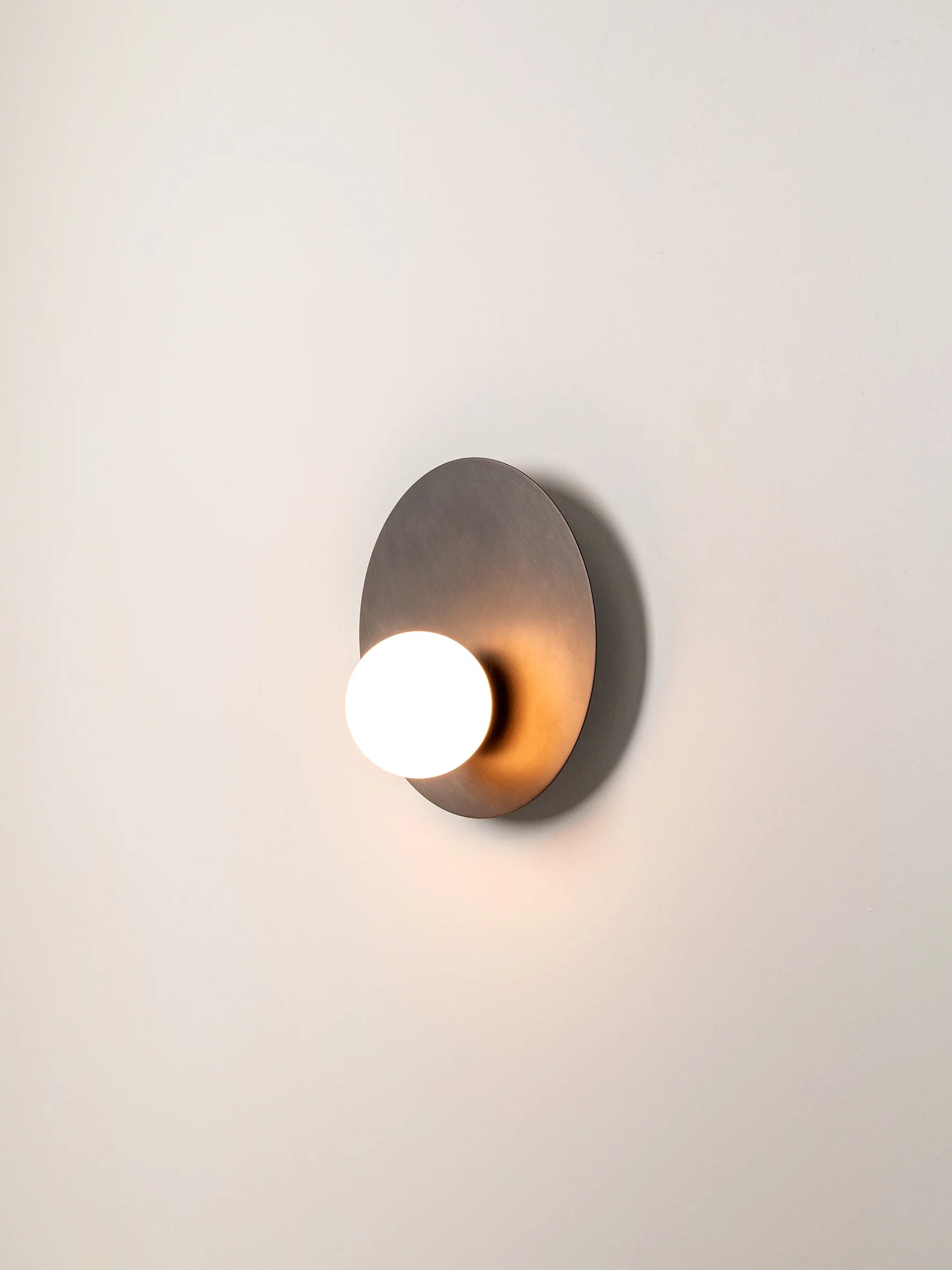 Luna - bronze and opal disc wall light