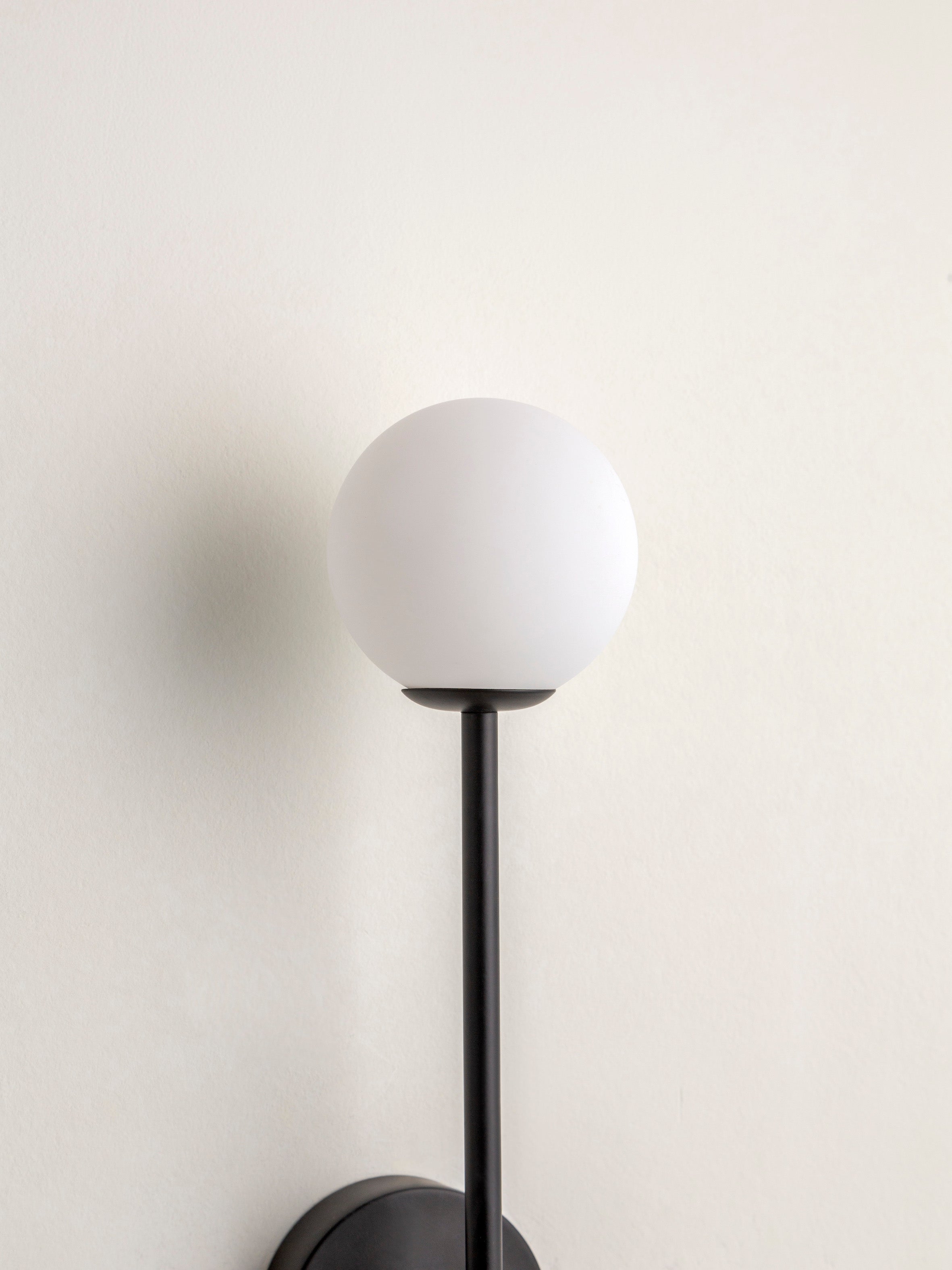 Chelso - matt black and opal wall light